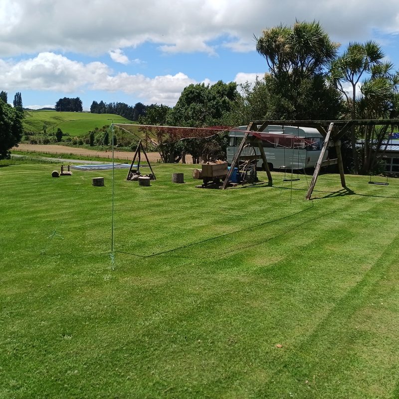 Campground with swing set and caravans